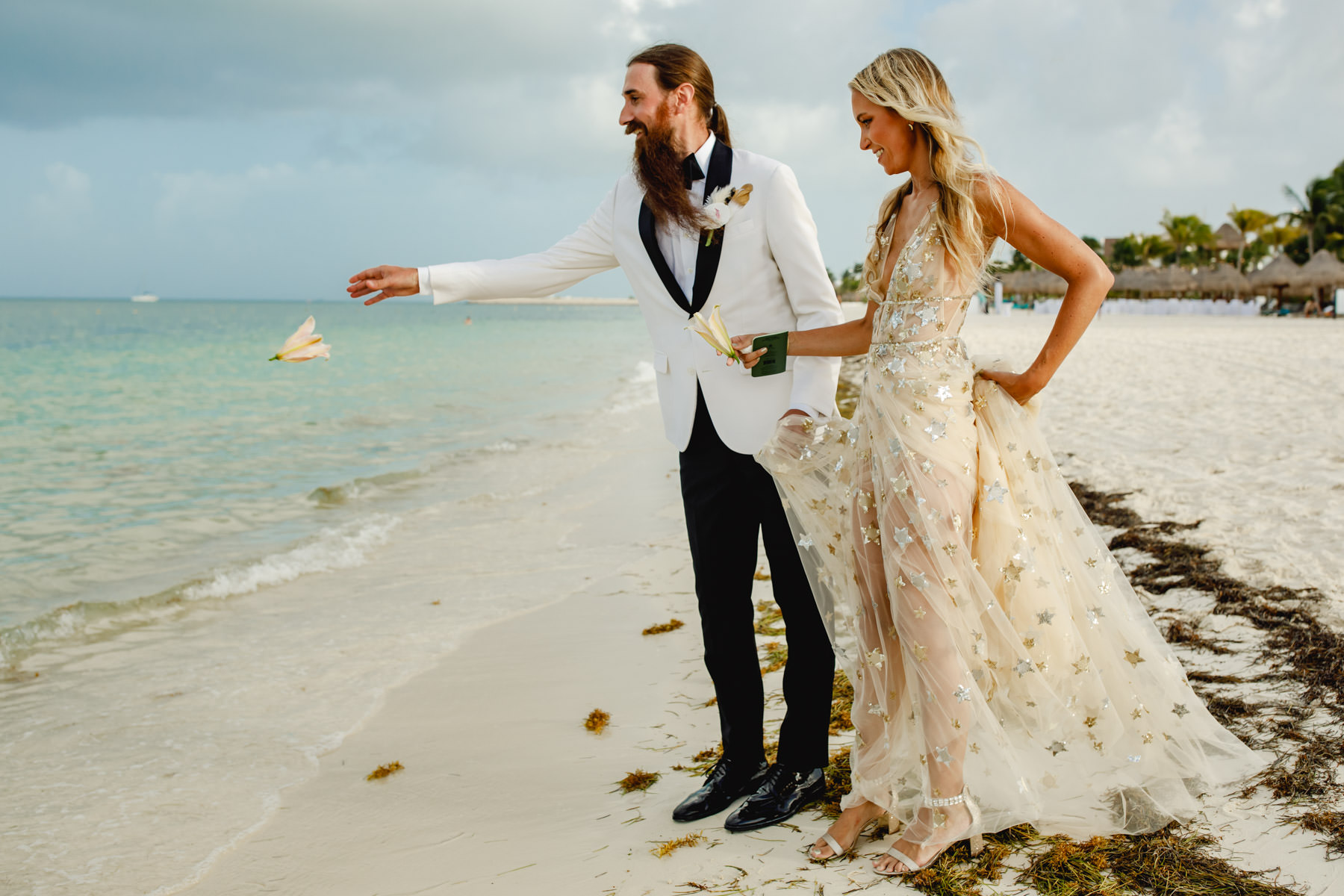 Lindsay and Joshua exchanging heartfelt vows against the backdrop of the shimmering ocean.