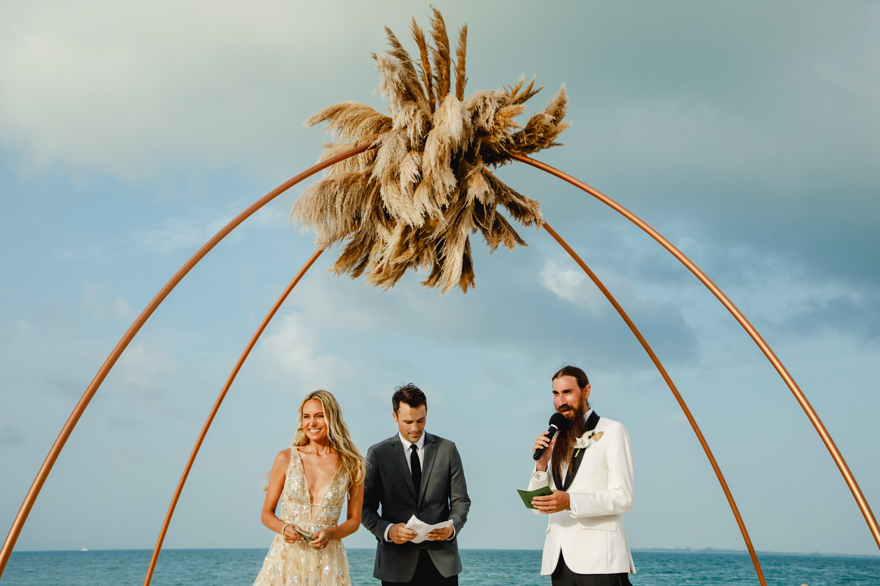 boho-inspired wedding gazebo at the beach of Finest Playa Mujeres captured by Mexico wedding photographer