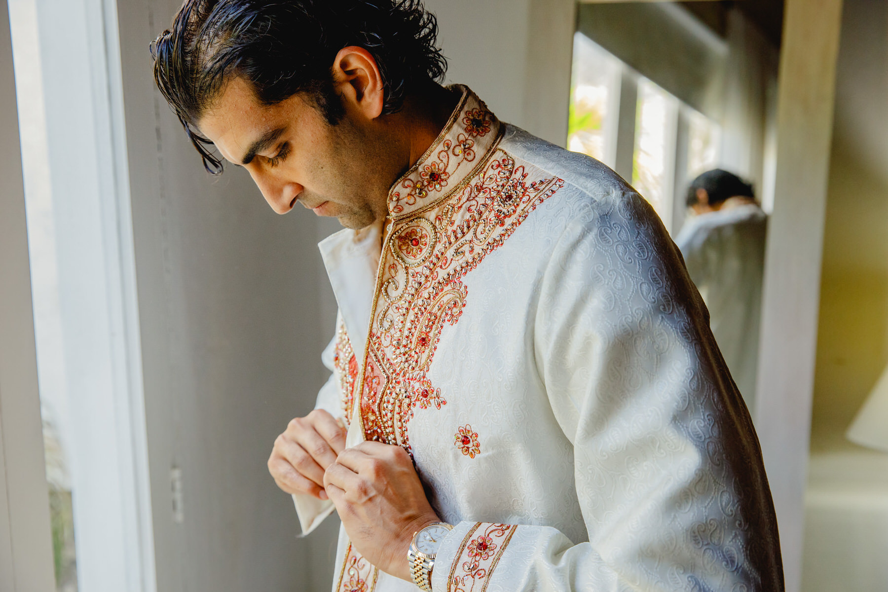 groom emanating charm and grace at his Indian wedding in Cartagena.