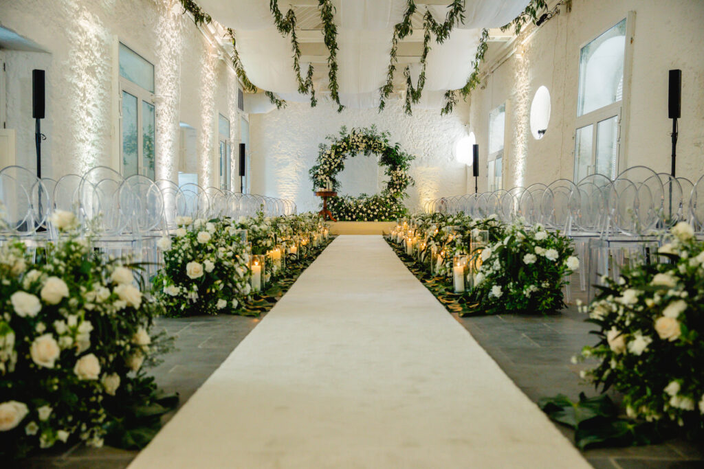 White floral arrangements for a fusion Indian wedding in Cartagena