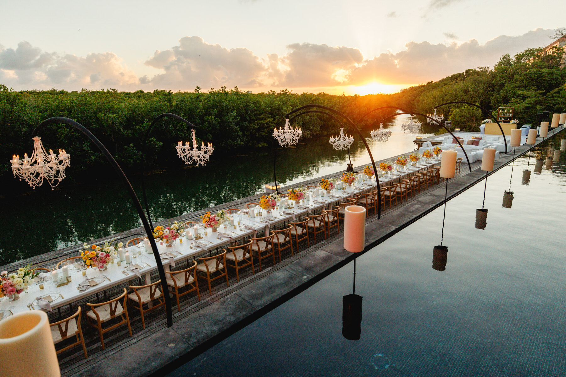 Wedding reception setup at Terra Nostra deck during sunset at Nizuc Resort and Spa Cancun captured by Take it Photo. 